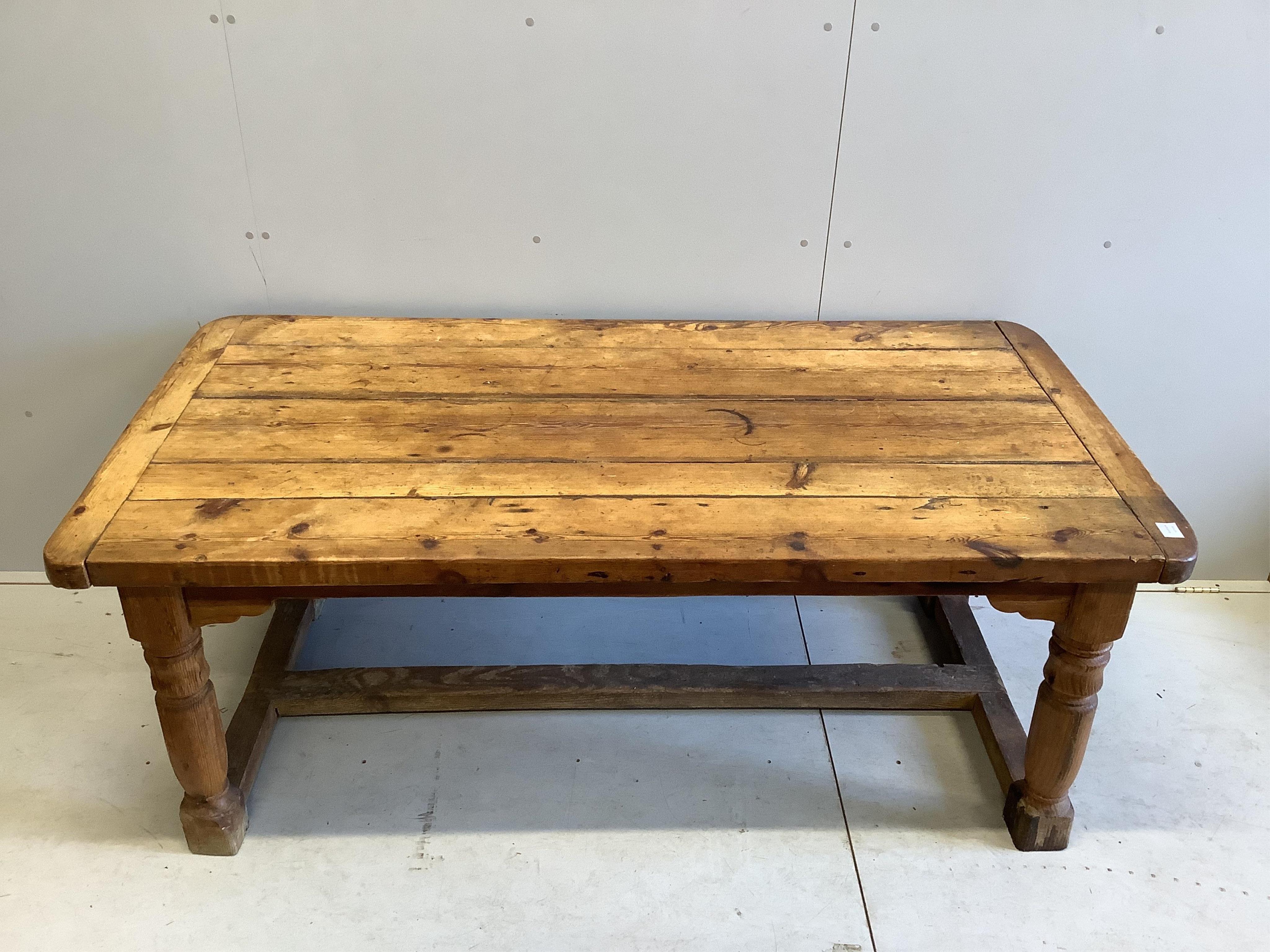 An 18th century style rectangular pine refectory table, width 180cm, depth 90cm, height 72cm. Condition - fair